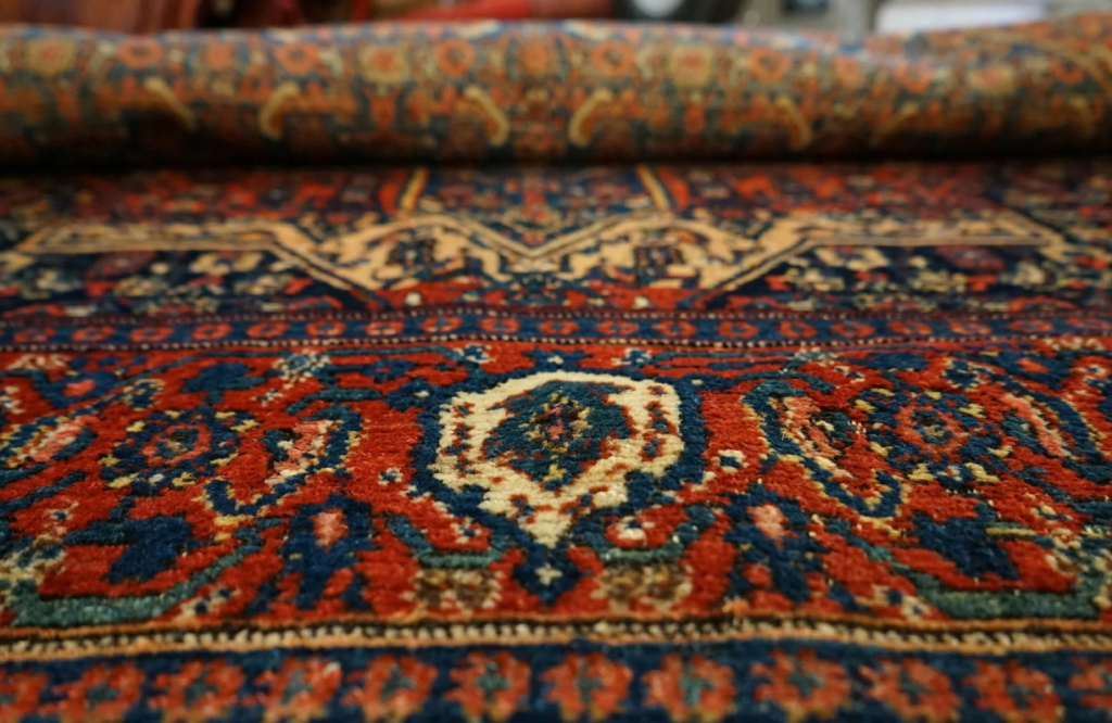 Close-up of antique oriental rug patterns and fibres