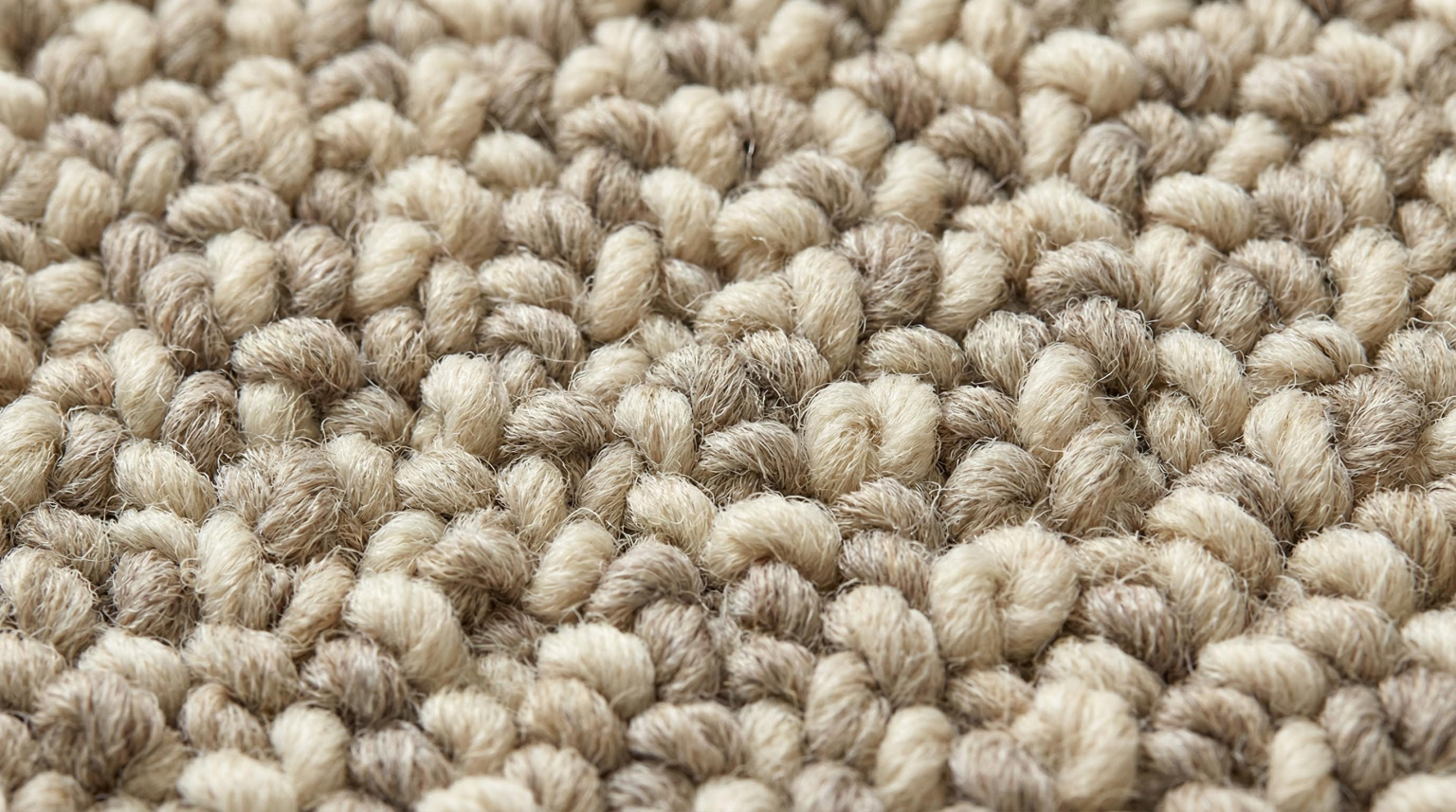 Close-up of a loop pile rug showing tightly formed yarn loops